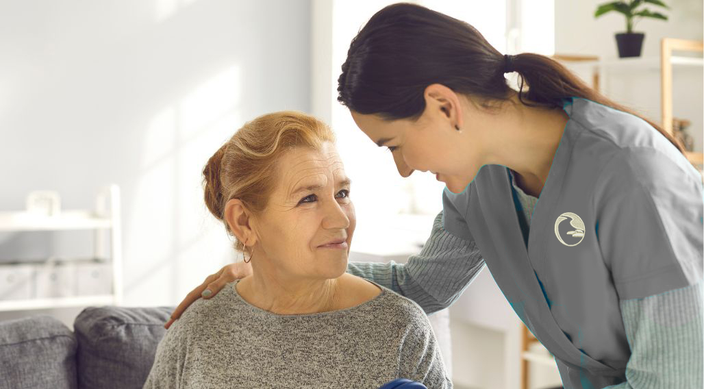 Family Nurse Practitioner providing care to an elderly patient in a home setting