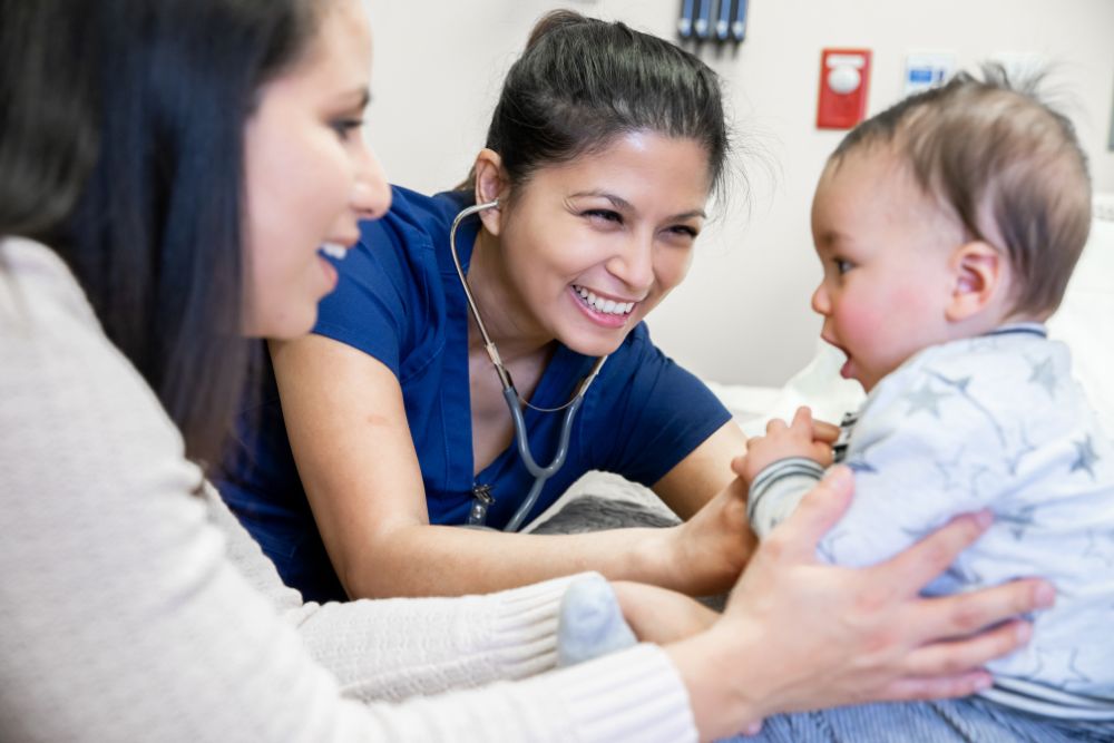 nurse examines baby